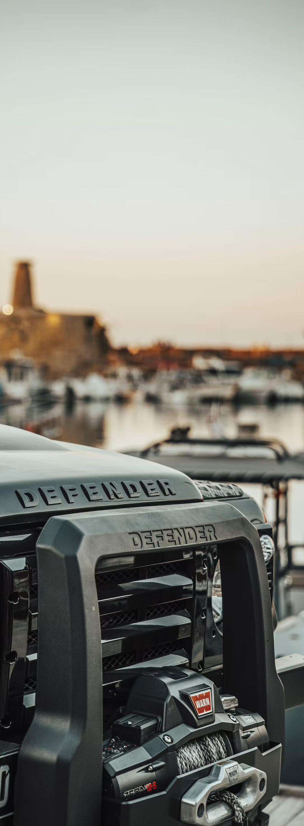 Off-road vehicle equipped with an electric winch and aftermarket accessories, representing custom automotive electrical installations and upgrades.